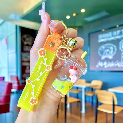 Yellow milk tea cup keychain with small animal